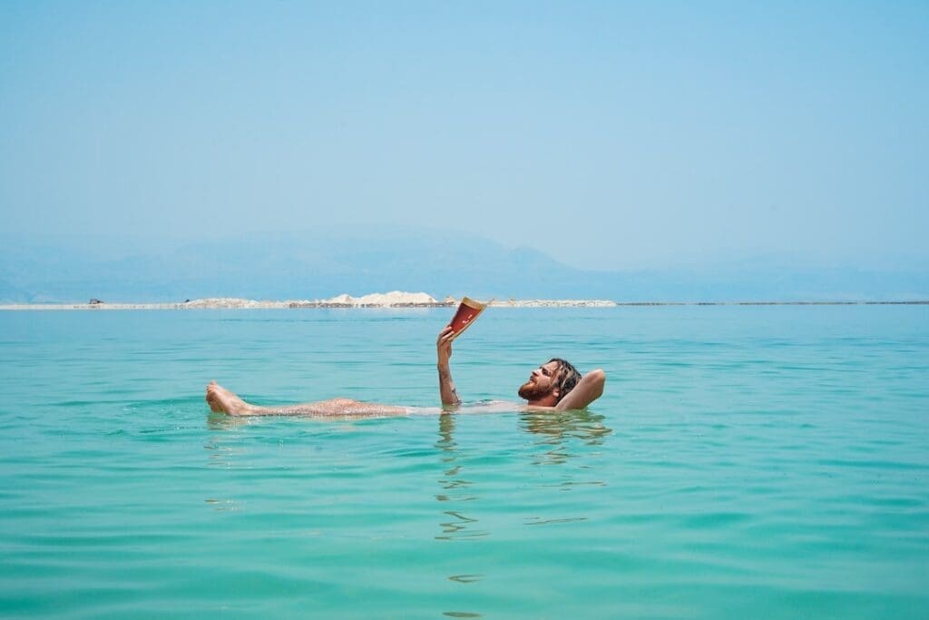 Man Reading a Book Floating in the Water Kavahana